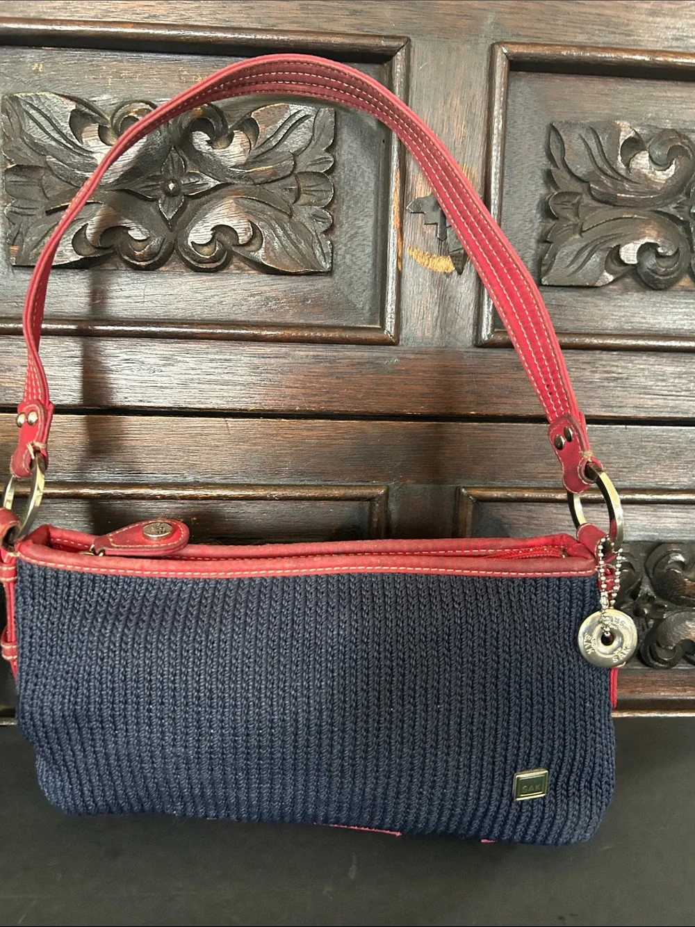 The Sak Navy Blue Crochet Woven Shoulder Bag with Red Trim